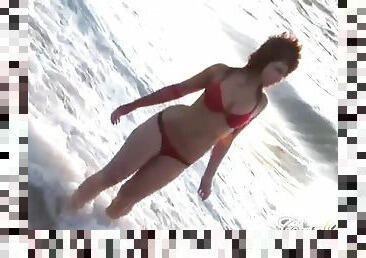 Hot babes on the beach seduce the camera
