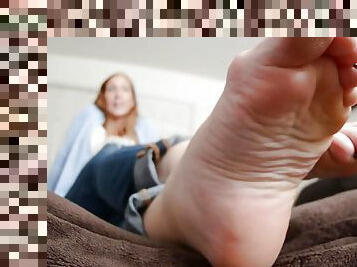 Mature ginger milf bares her soles