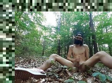 Skinny twink masturbates in a forest