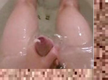 Teen male making a big strokes of cum while taking a bath