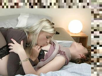 Two sensual blondes are fucking in the bedroom