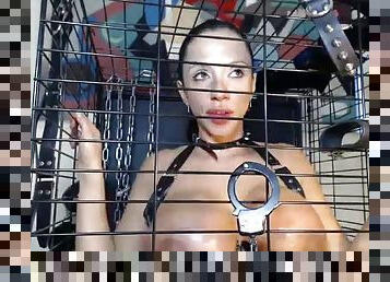 Ariella sucking dick through the cage