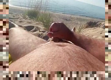 Solo male cum shot on a public beach