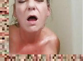 Naughty american milf loves fucking herself in the shower