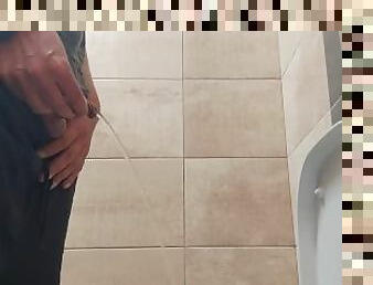 Pissing in a public toilet