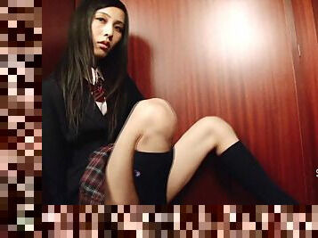 Shemale dressed in a schoolgirl uniform pulls on her hard dick