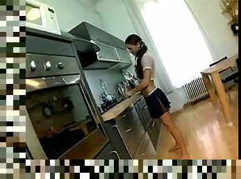 Petite brunette and handsome stud love each other in the kitchen.